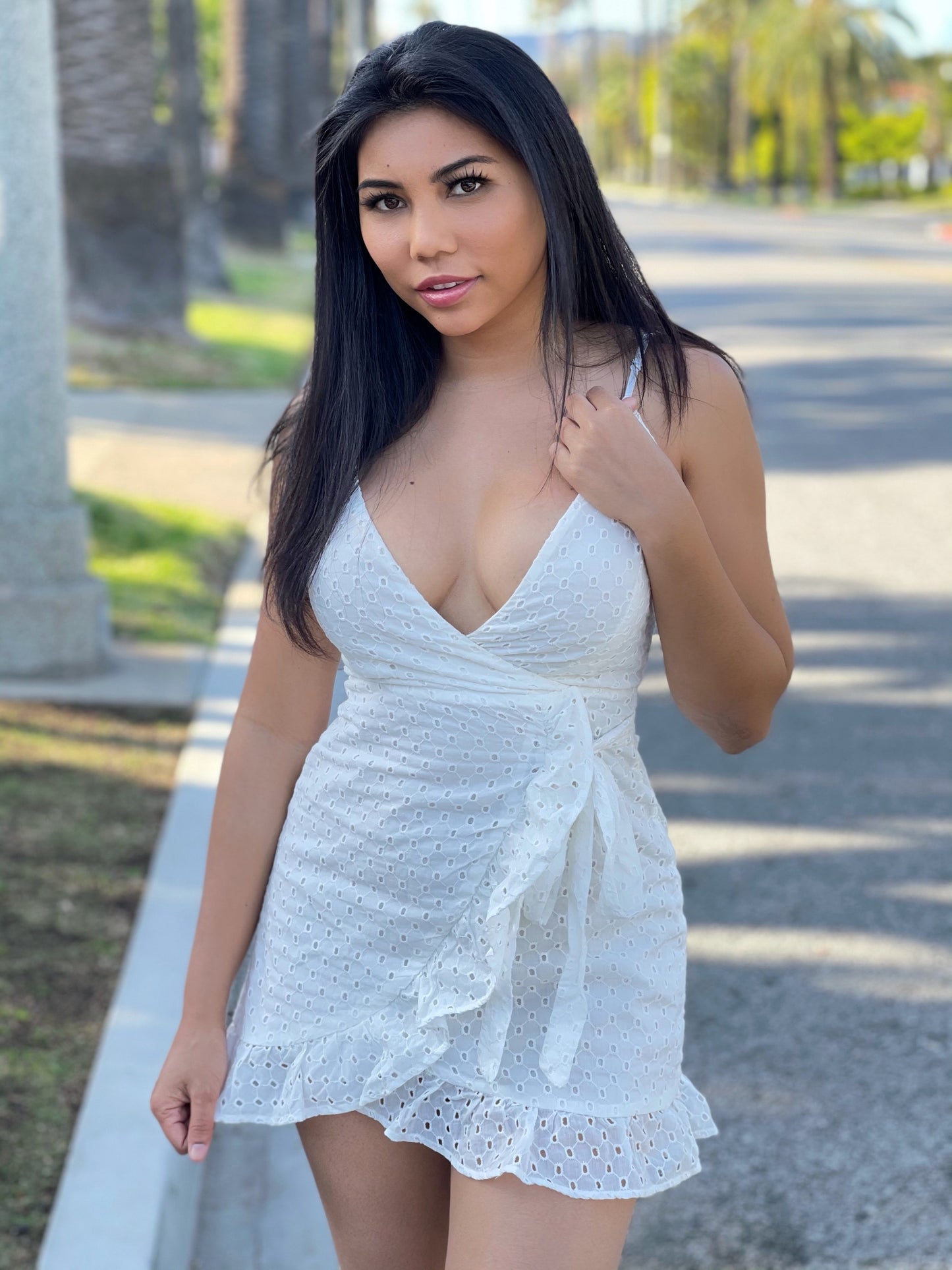 Look pretty in our white eyelet dress! This style is a warm weather staple that never goes out of style. Model is wearing a Small