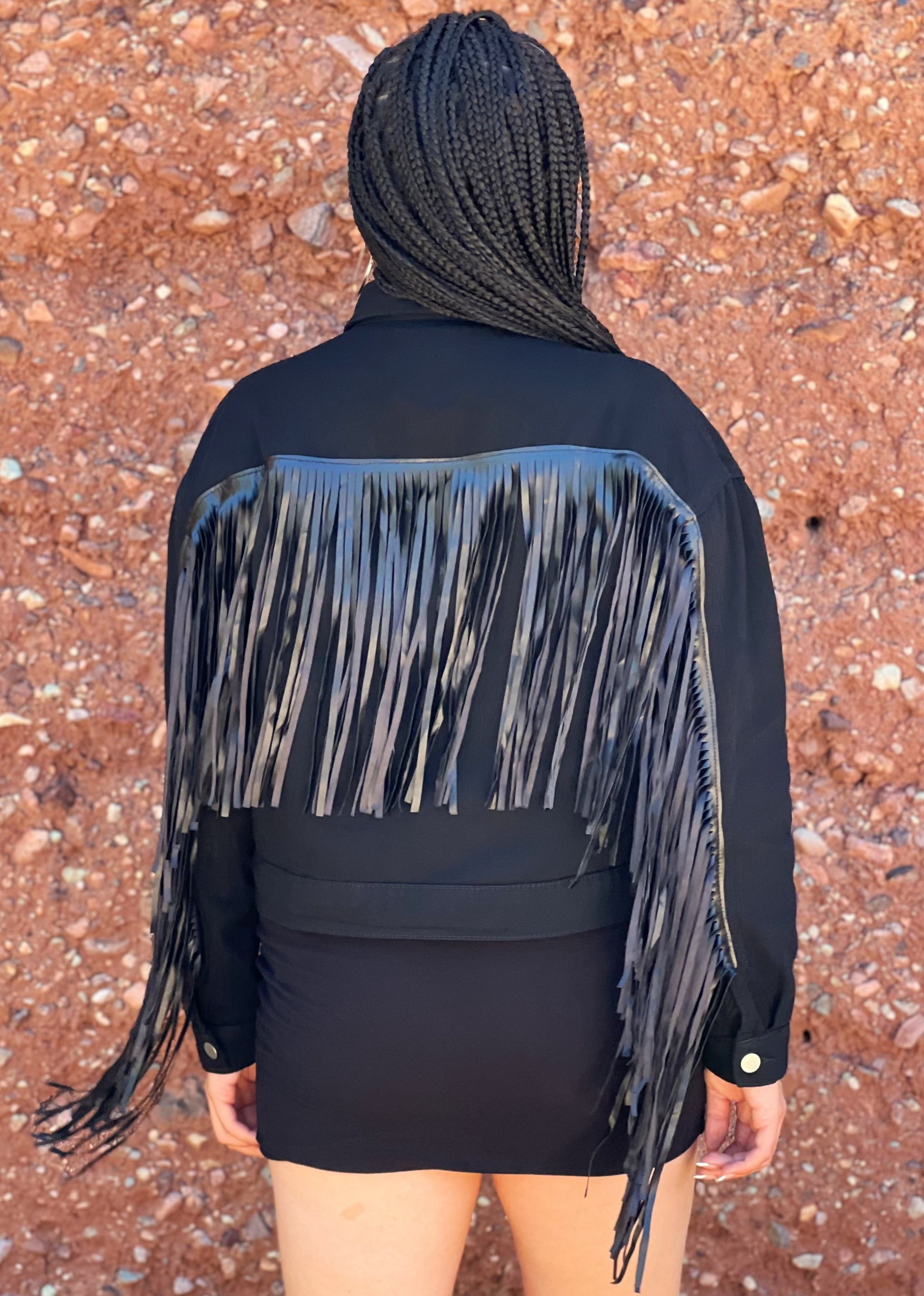 Command attention in this striking black fringe jacket. Its cropped length and intricate fringe detail create a silhouette. The fringe will dance with every movement, adding an element of playfulness to your country look.&nbsp;