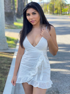 Look pretty in our white eyelet dress! This style is a warm weather staple that never goes out of style.  Model is wearing a Small