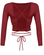 Load image into Gallery viewer, Show off some skin in this burgundy crop top! It features cross back detailing with a wrap tie.   Material: 96% POLYESTER 4% SPANDEX Made in the USA