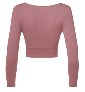 You'll look as beautiful as ever wearing this dusty rose colored long sleeve crop top. It features a v neck cut and side cut outs. The material is super stretchy, fitting, and soft.  96% Polyester 4% Spandex  Made in the US