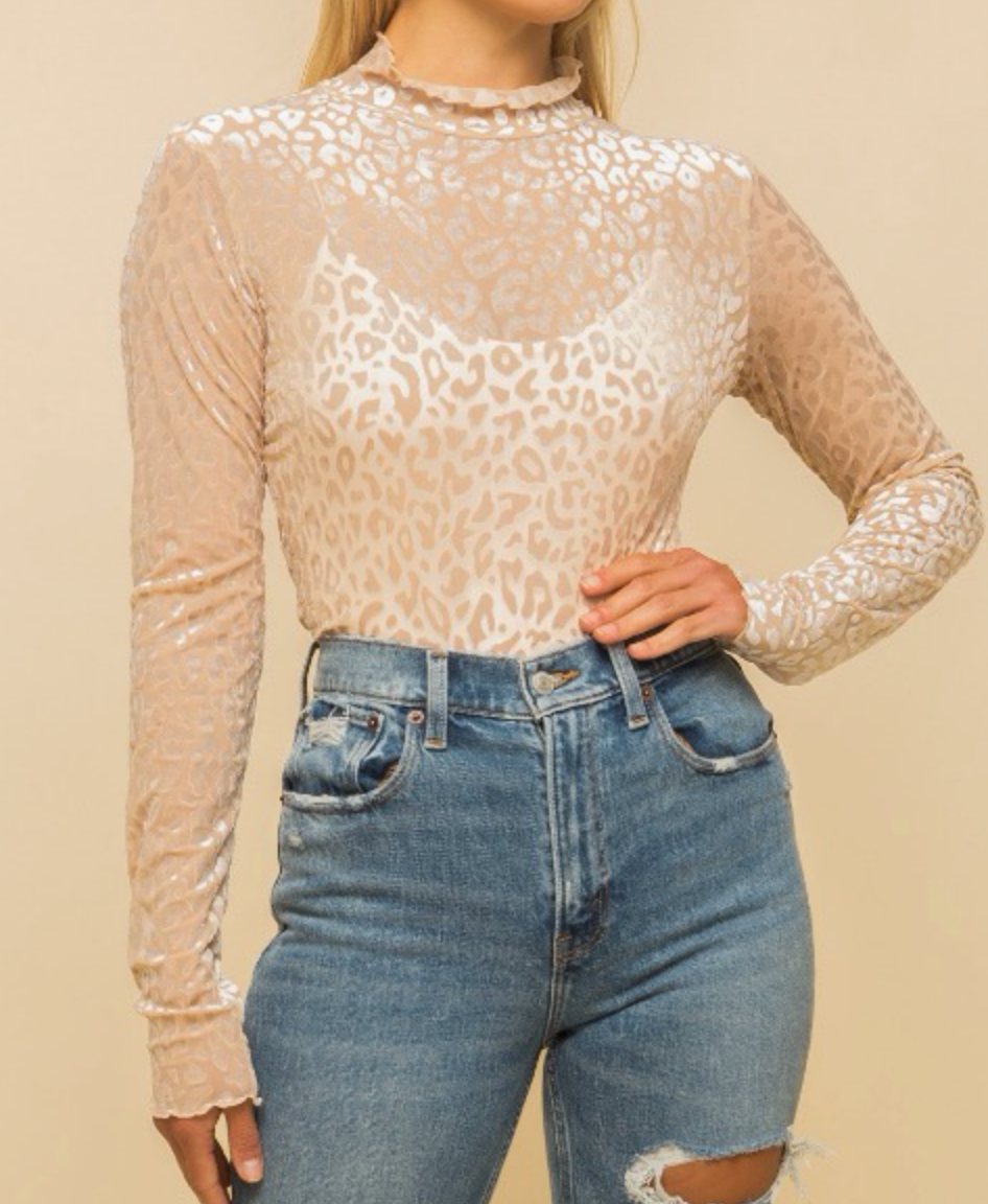 Velvet is timeless! We are loving this beige leopard print top with! Gold tip: Style with neutral heels, soft curls, and some hoops!  67% Polyester 23% Nylon 10% Spandex