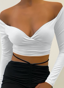 This stunning crop top is a need. It features a V neck and tunnel sleeve. Gold tip: pair it with our Flirty Flare Pants.  Made in the US 96% Polyester 4% Spandex