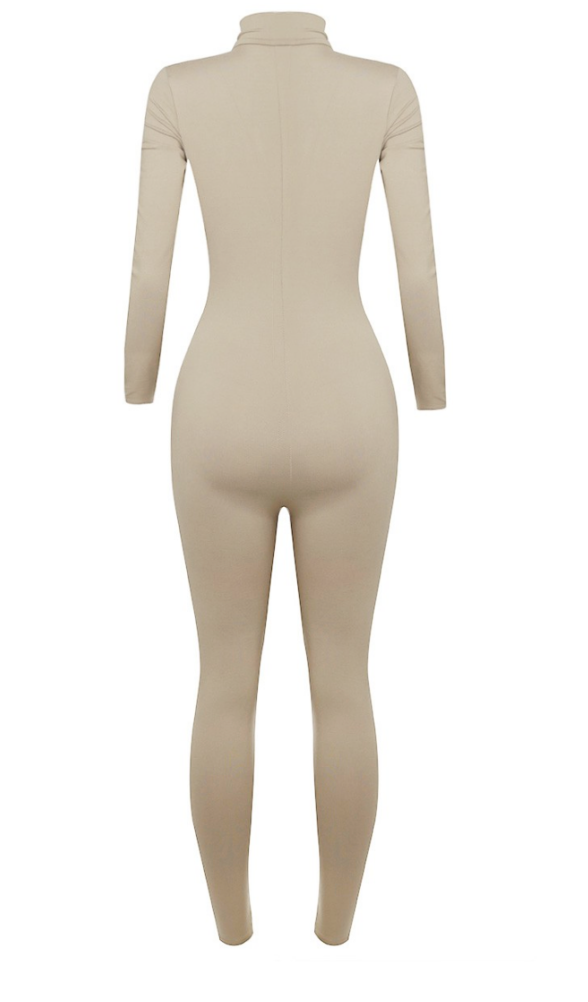 A must-have! It features a mock neck, zipper, and figure-hugging brushed material. It can be layered or worn alone for a comfy fit. It'll keep you warm, but the material is breathable. It is also super soft!  Made in the US 82% Polyester / 18% Spandex
