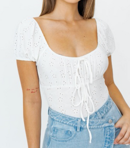An effortless eyelet bodysuit that will be perfect for your Spring outfits.  93% Polyester 7% Spandex