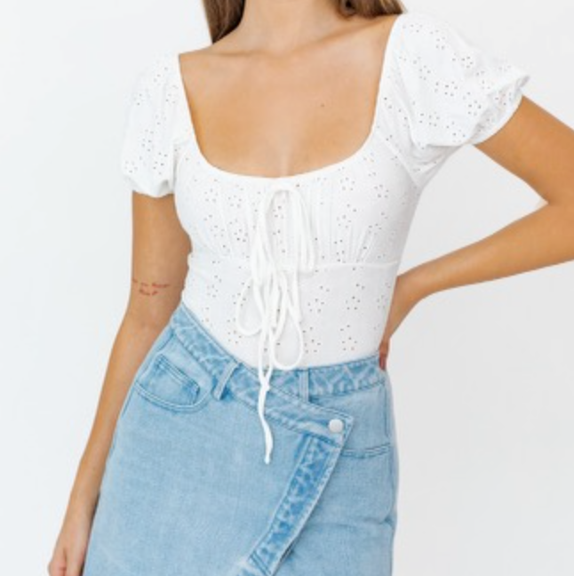 An effortless eyelet bodysuit that will be perfect for your Spring outfits.  93% Polyester 7% Spandex