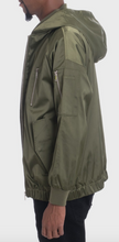 Load image into Gallery viewer, Details are everything! This olive green satin jacket is light-weight and it has utility pockets.   Regular fit  100% Polyester  Machine Washable and Dryable MA-1 flight lined with full zip on the front Cold Machine Wash and Tumble Low Dry Recommended    *Model is wearing a medium and is 6&#39;2