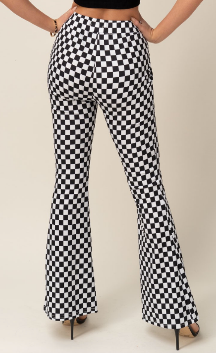 Are you ready to be checked out? These checkered flare pants will add a fun twist to your look.  95% Polyester 5% Elastane