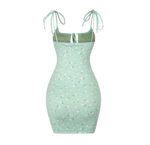 A sage green floral dress that's made for Spring. It features a drawstring and self ties. It's single-layered and is lined.  Soft and stretchy Made in the US 96% Polyester / 4% Spandex