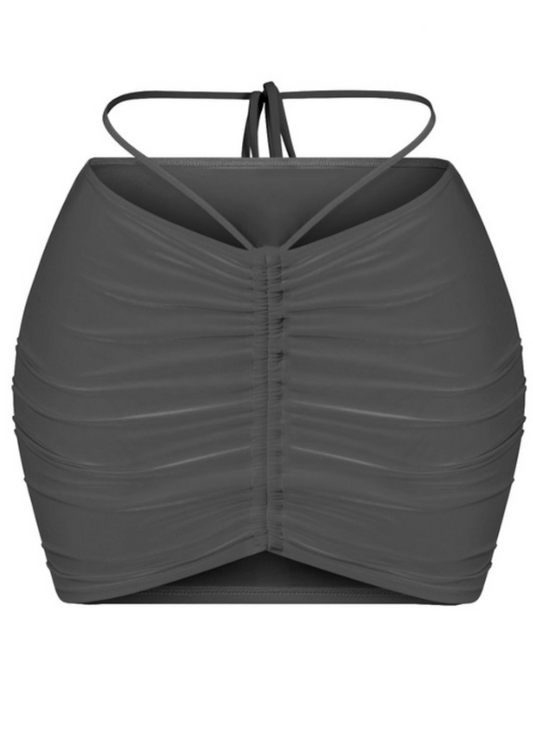 This mini skirt is perfect for spicing up your looks. It features: Stretchy  Low waist  Waist self-tie Made in the US Double-layered Ruched detailing