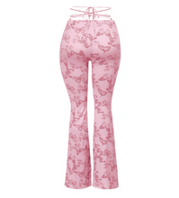 Load image into Gallery viewer, These trendy mauve butterfly flare pants are super cute and in this season! They are full length and feature:  Soft Stretchy Front self-tie Made in the US Front ruched detail 94% Polyester and 6% Spandex General sizing chart:   Sizes 2-4: Small  Sizes 4-6: Medium  Sizes 6-8: Large  Recommended:   Size down for a tighter fit