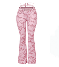 Load image into Gallery viewer, These trendy mauve butterfly flare pants are super cute and in this season! They are full length and feature:  Soft Stretchy Front self-tie Made in the US Front ruched detail 94% Polyester and 6% Spandex General sizing chart:   Sizes 2-4: Small  Sizes 4-6: Medium  Sizes 6-8: Large  Recommended:   Size down for a tighter fit